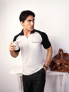 BLACK REGLAN POCKET POLO